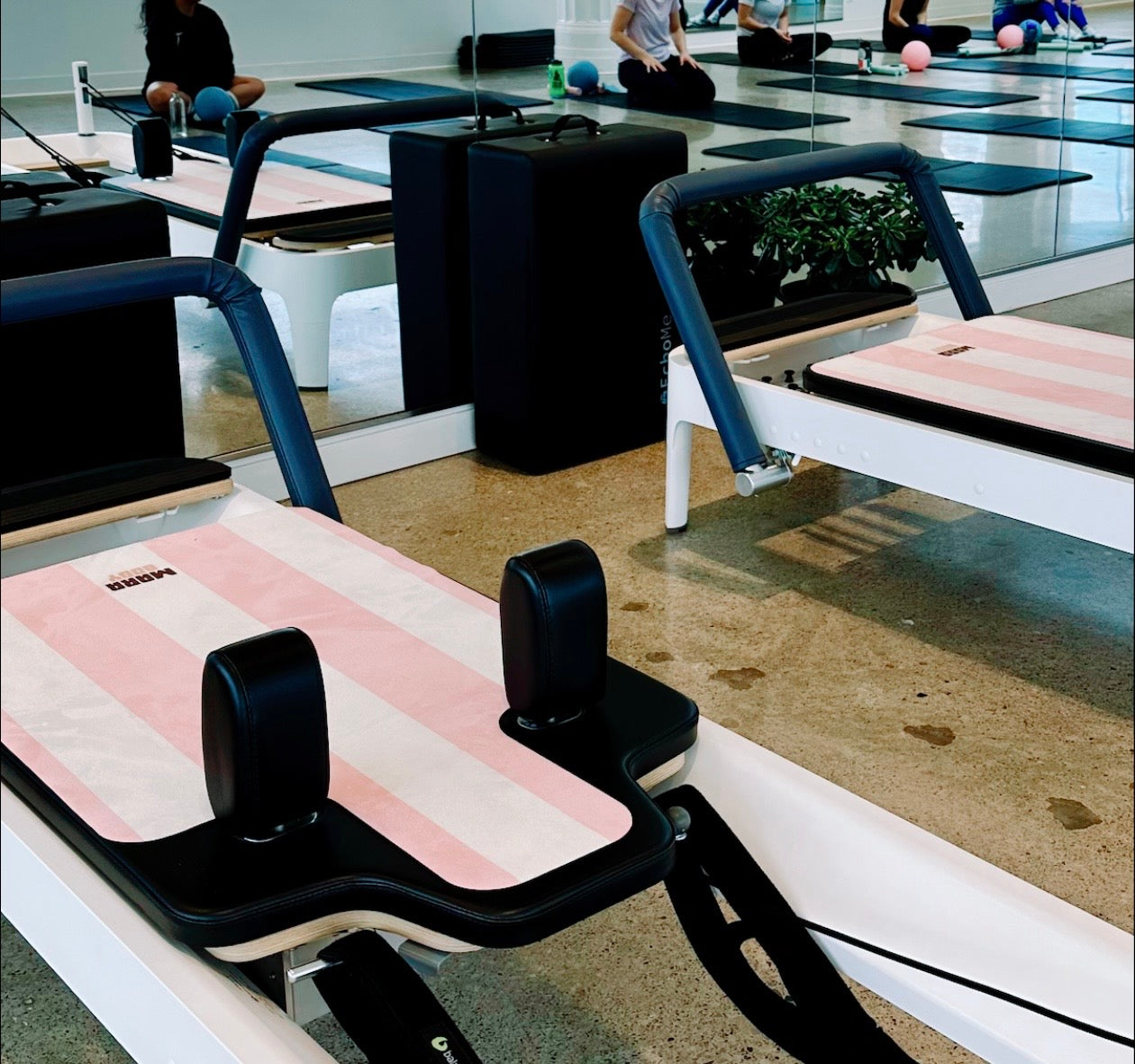 Pink and white striped pilates reformer mats, pilates studio in Toronto, pilates reformer mat canada, pilates studio inspo, pilates studio decor, pilates studio decor pinterest, reformer mat, pilates reformer mat design