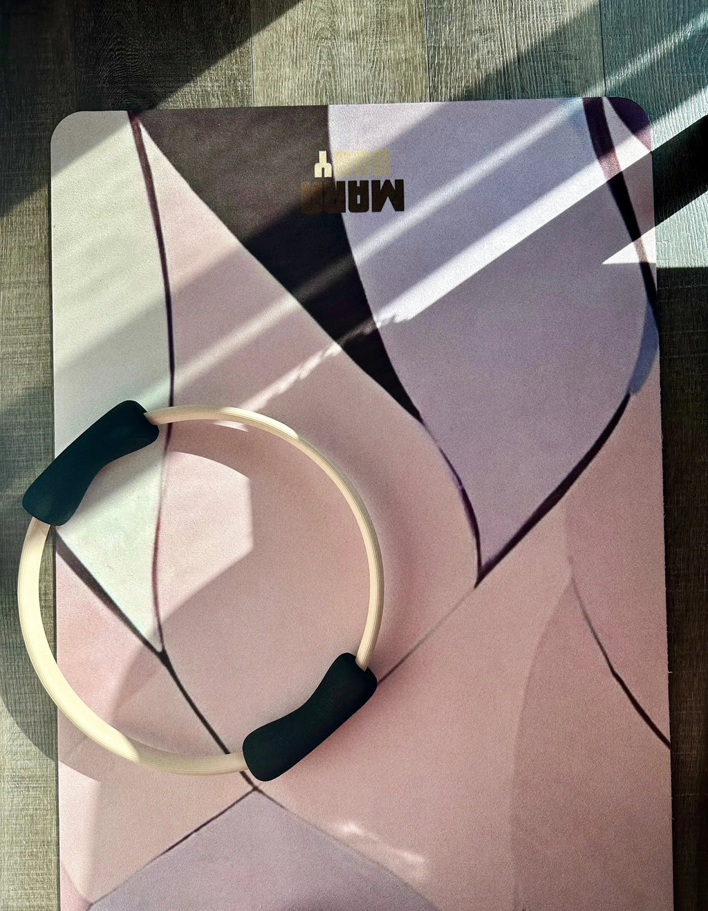 Pilates ring on a patterned design yoga mat