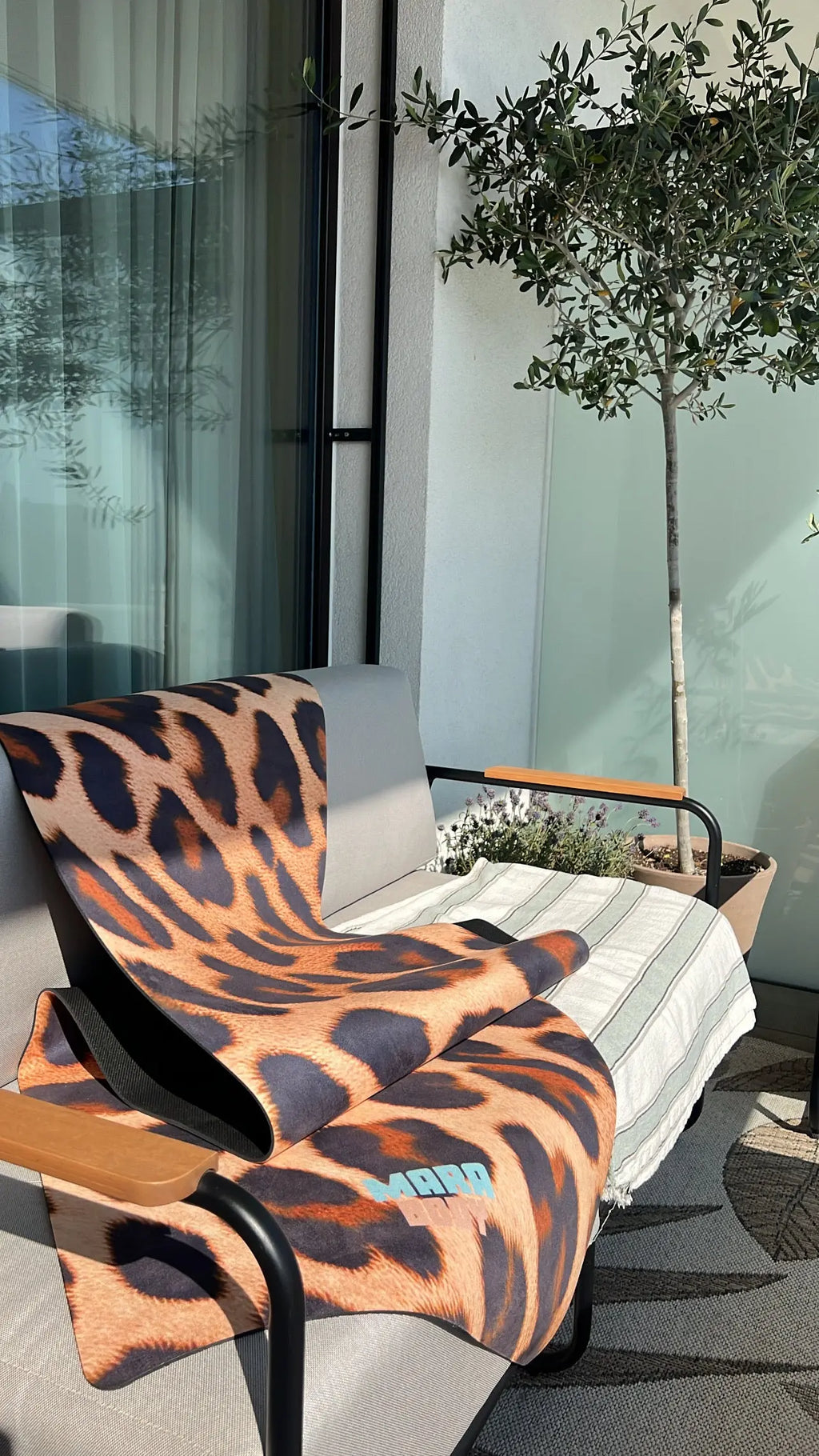 leopard print yoga mat mara body on top of n outdoor lounge sofa