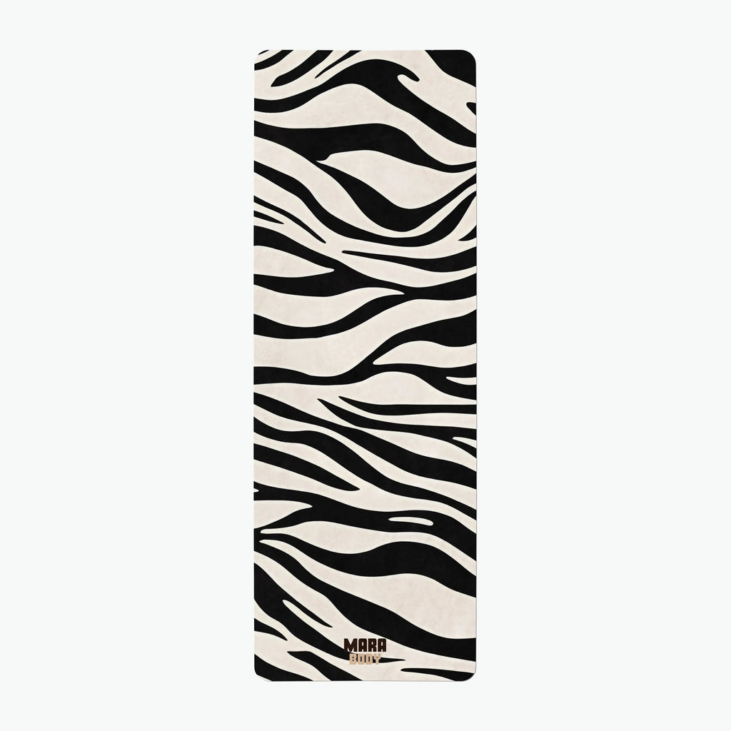 Yoga mat with zebra pattern on a white background